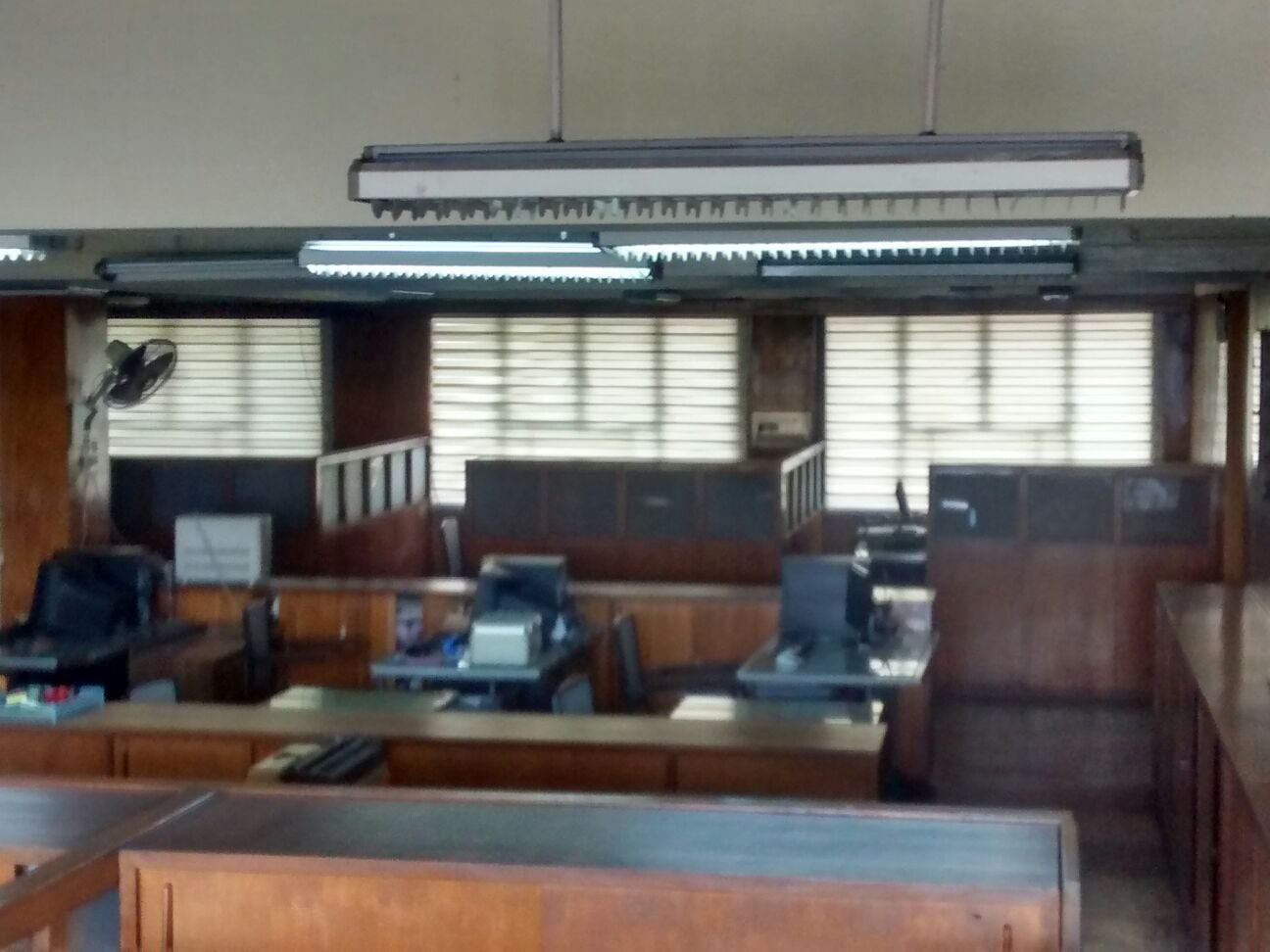 Office fit-out with rows of teak workstation desks